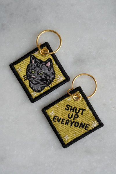 STAY HOME CLUB Porte-clés Taisez-vous Tous !